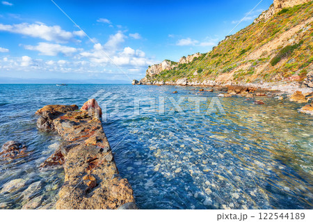 Picturesque spring view on the the cape Milazzo panorama of nature reserve Piscina di Venere. Picturesque spring view on the the cape Milazzo panorama of nature reserve Piscina di Venere. 122544189