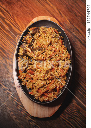 Pilaf in beautiful dishes is on the table in the 122544705