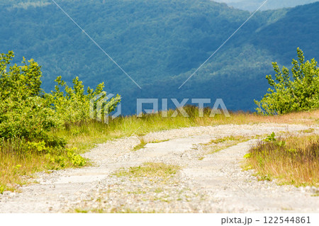 old concrete mountain road. vacation season. path through smooth mount on a cloudy day. travel ukraine alpine scenery old concrete mountain road. vacation season. path through smooth mount on a cloudy day. travel ukraine alpine scenery 122544861
