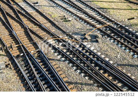 Railway tracks crossing on railway station  122545512