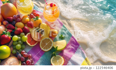 Beach picnic with fresh fruit and cocktails. 122546406
