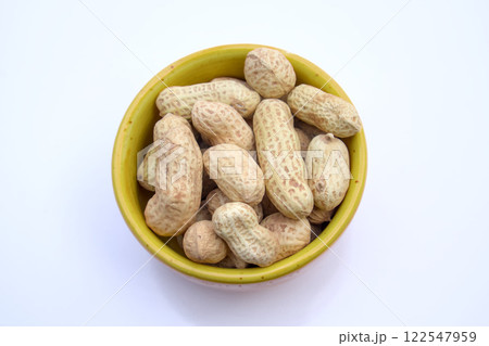Peanuts, Groundnuts, Goobers in a bowl, Top View, Isolated, White Background 122547959