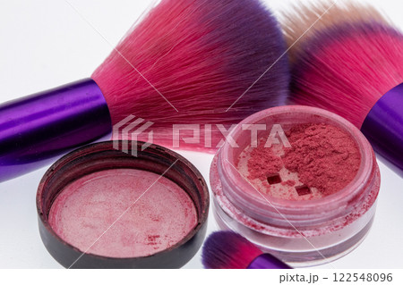 Purple and pink makeup brushes close up shot Purple and pink makeup brushes close up shot 122548096