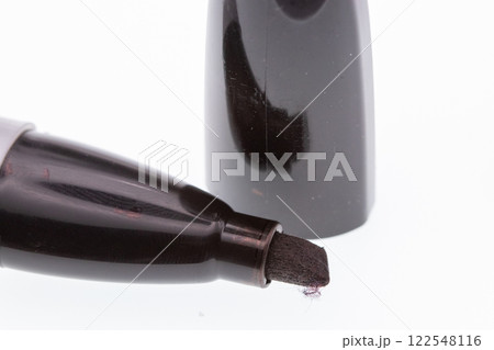 Close up of fat black marker tip and lid Close up of fat black marker tip and lid 122548116