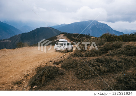 Tibet ,China - March 19 2022: Driving off road car in high altitude mountains in tibet, China Tibet ,China - March 19 2022: Driving off road car in high altitude mountains in tibet, China 122551924