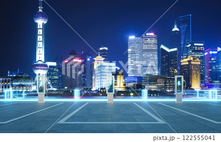Electric vehicle charging station illuminating shanghai skyline at night Electric vehicle charging station illuminating shanghai skyline at night 122555041