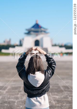 woman traveler visiting in Taiwan, female Tourist sightseeing at National Chiang Kai shek Memorial or Hall Freedom Square, Taipei City. Popular landmark and attractions. Asia Travel concept woman traveler visiting in Taiwan, female Tourist sightseeing at National Chiang Kai shek Memorial or Hall Freedom Square, Taipei City. Popular landmark and attractions. Asia Travel concept 122555139