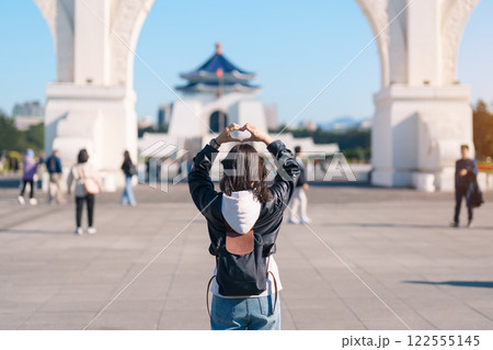 woman traveler visiting in Taiwan, female Tourist sightseeing at National Chiang Kai shek Memorial or Hall Freedom Square, Taipei City. Popular landmark and attractions. Asia Travel concept woman traveler visiting in Taiwan, female Tourist sightseeing at National Chiang Kai shek Memorial or Hall Freedom Square, Taipei City. Popular landmark and attractions. Asia Travel concept 122555145