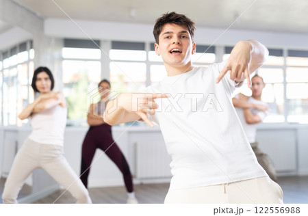 Group of young people dancing hip hop Group of young people dancing hip hop 122556988