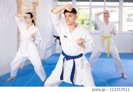 Group of people training karate technique 122557011