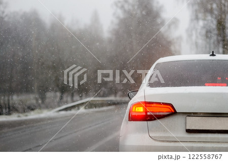 A car on the road in the first days of winter and frost A car on the road in the first days of winter and frost 122558767