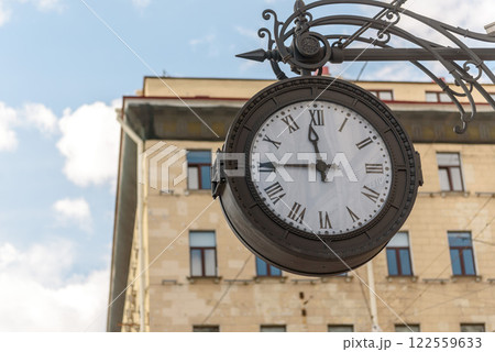 Russia, Saint Petersburg, September 2023: wall street clock on the wall of the building on Nevsky Prospekt Russia, Saint Petersburg, September 2023: wall street clock on the wall of the building on Nevsky Prospekt 122559633