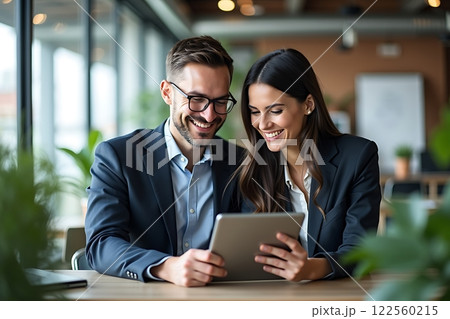 Professional Collaboration in Modern Office Setting Professional Collaboration in Modern Office Setting 122560215