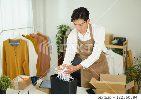 Small business owner preparing a parcel for delivery 122560394