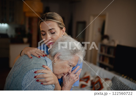 Psychologist provides mental health support and grief counseling to elderly patient. Psychologist provides mental health support and grief counseling to elderly patient. 122560722