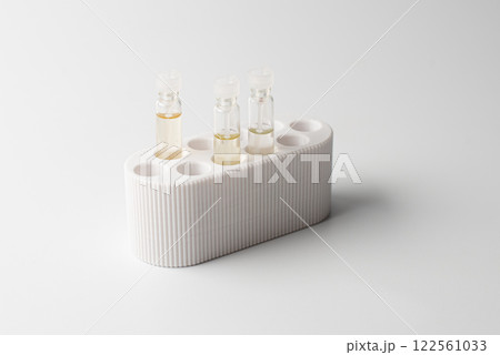 Perfume samples on white background 122561033