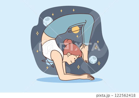 Woman practices yoga and pilates, taking difficult pose and imagining cosmos full stars and planets 122562418