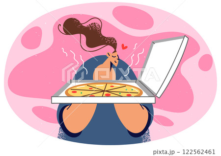 Happy woman smell tasty pizza in box Happy woman smell tasty pizza in box 122562461
