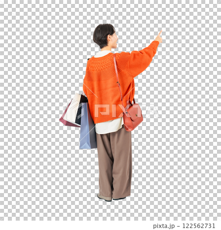 The back view of a middle-aged woman holding a shopping bag and pointing at it. A transparent full-body photo PNG precisely cut by hand 122562731