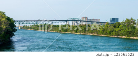 Jacques Cartier Bridge at Longueuil side. View from Notre-Dame Island. Quebec, Canada. Jacques Cartier Bridge at Longueuil side. View from Notre-Dame Island. Quebec, Canada. 122563522