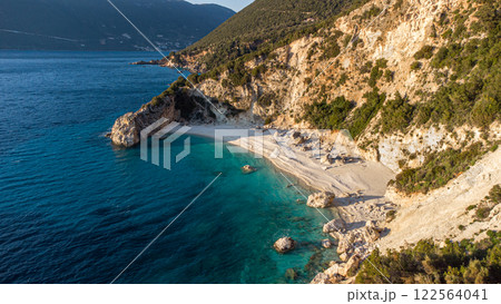 Aerial view of a stunning beach on a cliff overlooking the ocean 122564041