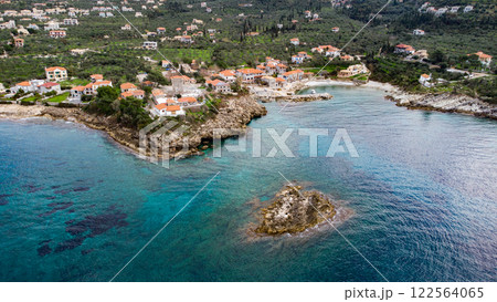 Aerial view of small village in the Peloponnese. Olive trees. Blue water. Greece Aerial view of small village in the Peloponnese. Olive trees. Blue water. Greece 122564065