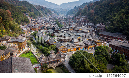 Zhaoxing Dong Ethnic village aerial view. Traditional houses. Bridge. China Zhaoxing Dong Ethnic village aerial view. Traditional houses. Bridge. China 122564097