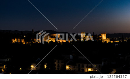 Experience the stunning and dramatic nighttime view of the Alhambra fortress 122564357