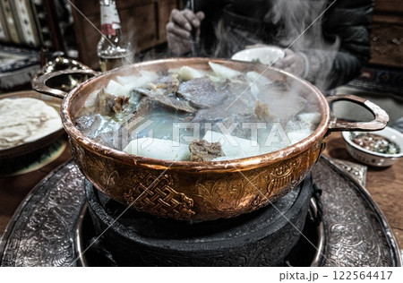 Tibetan Chinese Yak Hot Pot in Shangri-La old town. Diqing. Yunnan, China. Tibetan Chinese Yak Hot Pot in Shangri-La old town. Diqing. Yunnan, China. 122564417