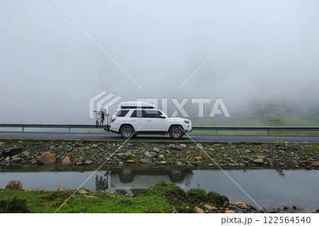 Driving car in beautiful nature 122564540