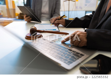 Business people and lawyers discussing contract papers sitting in the table at office in the morning. concepts of law, advice, legal services. 122565332