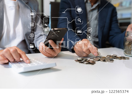 concept with saving money, accountant working on desk in home using calculator and laptop to calculate budget. concept with saving money, accountant working on desk in home using calculator and laptop to calculate budget. 122565374