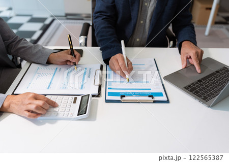 Business meeting account managers crew working search page on computer with new startup project. Idea presentation, analyze plans. Business meeting account managers crew working search page on computer with new startup project. Idea presentation, analyze plans. 122565387