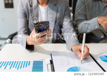 Businessman working and update tasks with milestones progress planning and professional investor working new start up project in the office. Businessman working and update tasks with milestones progress planning and professional investor working new start up project in the office. 122565397
