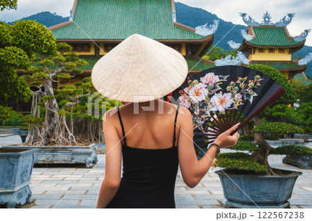 woman tourist traveler at Buddhist temple at Linh Ung Pagoda in Da Nang in Vietnam. Concept of travel and tourism in Asia 122567238