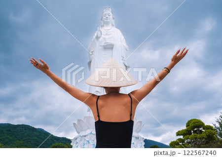 woman tourist traveler at Lady Buddha statue at Linh Ung Pagoda in Da Nang in Vietnam. The concept of travel and tourism in Asia woman tourist traveler at Lady Buddha statue at Linh Ung Pagoda in Da Nang in Vietnam. The concept of travel and tourism in Asia 122567240