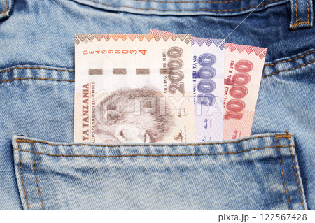 Tanzanian shilling in the pocket of blue jeans Tanzanian shilling in the pocket of blue jeans 122567428