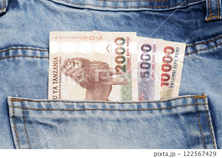 Tanzanian shilling in the pocket of blue jeans Tanzanian shilling in the pocket of blue jeans 122567429