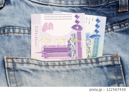 Sudanese Pound in the pocket of blue jeans Sudanese Pound in the pocket of blue jeans 122567430