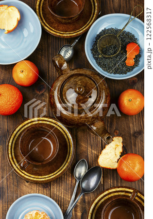 Tangerine tea in a glass teakettle. Tangerine tea in a glass teakettle. 122568317