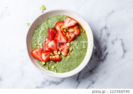 Green matcha chia pudding with strawberries and pistachios. Green matcha chia pudding with strawberries and pistachios. 122568540