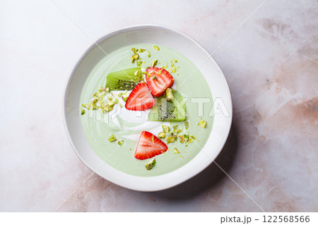 Green matcha yogurt with berries and pistachio. Vegan breakfast concept. 122568566