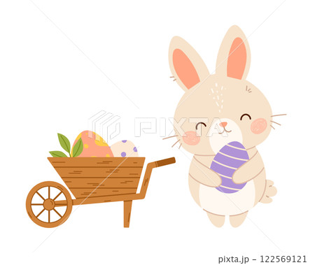 Easter bunny rabbit with wheelbarrow of eggs. Flat vector isolated illustration Easter bunny rabbit with wheelbarrow of eggs. Flat vector isolated illustration 122569121