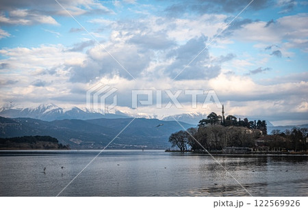 Ioannina lake: Greece undiscovered gem. Ottoman legacy. Snowy mountains. Mosque Ioannina lake: Greece undiscovered gem. Ottoman legacy. Snowy mountains. Mosque 122569926