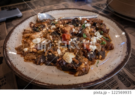 Traditional Greek plate with aubergine and feta cheese slowly cooked. Ioannina 122569935