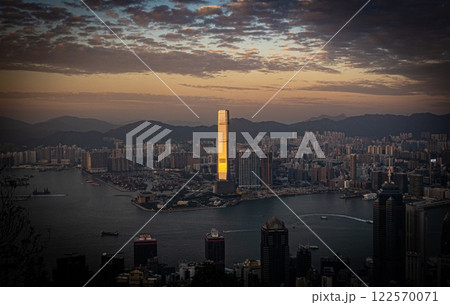 Aerial view of Hong Kong at sunset with boats in the strait 122570071