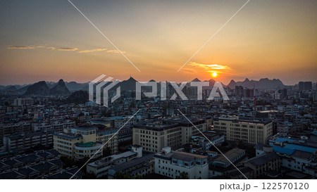 A sunset aerial view of Guilin city with karst mountains in the back. China 122570120