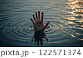 Man in trouble, the hand of the drowning man sticking out of the water 122571374