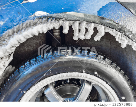 Icicles Are Forming under a Car wheel arch Harsh Winter Conditions and Cold Environments 122573999
