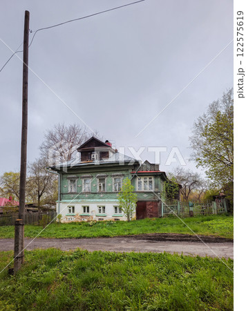old green wooden house with mezzanine old green wooden house with mezzanine 122575619